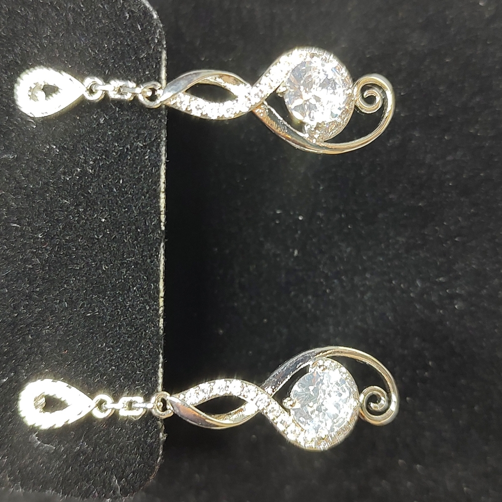 Rhinestone silver tone earrings. NWOT